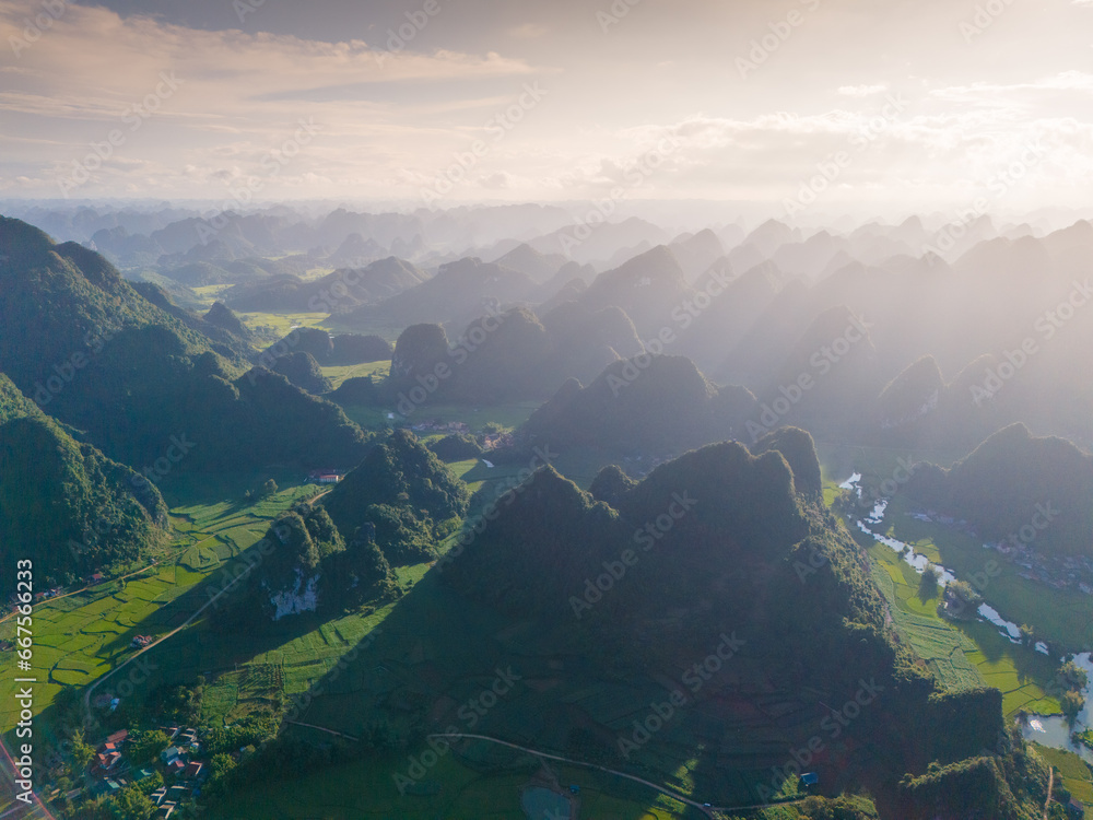 Aerial landscape in Phong Nam valley, an extreme scenery landscape at Cao bang province, Vietnam with river, nature, green rice fields Aerial landscape in Phong Nam valley, an extreme scenery landscape at Cao bang province, Vietnam with river, nature, green rice fields