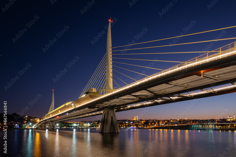 Night view of the illuminated Golden Horn metro bridge, Istanbul, Turkey