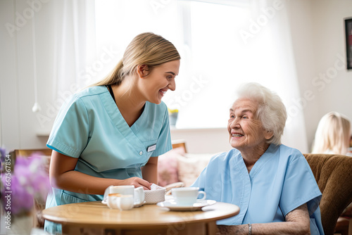 Female nurse working with an elderly lady. photo