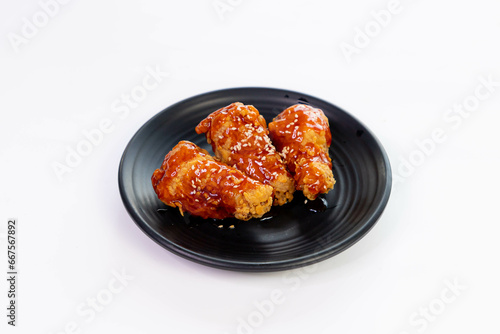 Fried Chicken with Korean Sauce Crispy fried chicken arranged on a plate Food menu for menu design