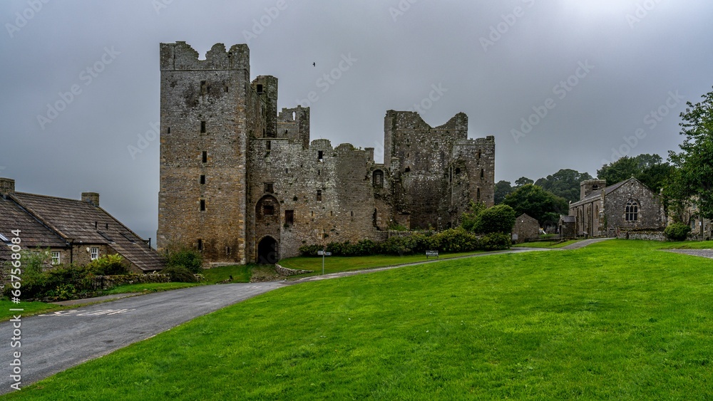 Bolton castle surrounded by lush green grass, Bolton Castle, North Yorkshire, UK