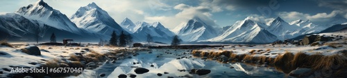 A picturesque scene of a snowy mountain range, with a serene lake nestled among snow-covered peaks in the foreground, under a cloudy sky in the background. photo
