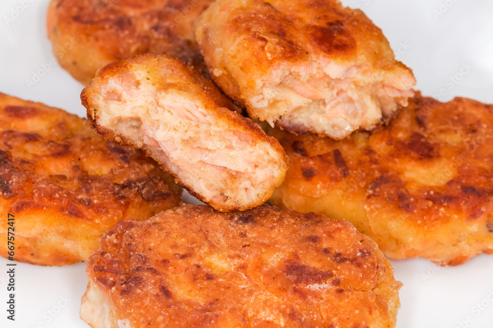Fried breaded fish cutlets made with minced salmon close-up Fried breaded fish cutlets made with minced salmon close-up