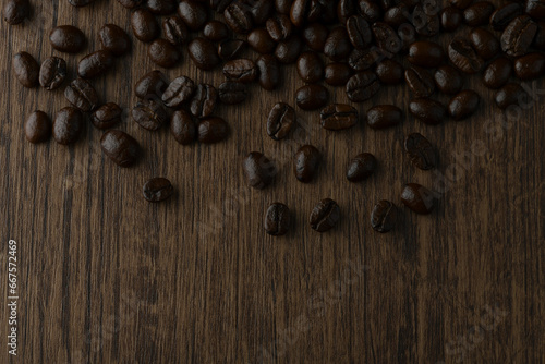Roasted coffee bean on wooden table.