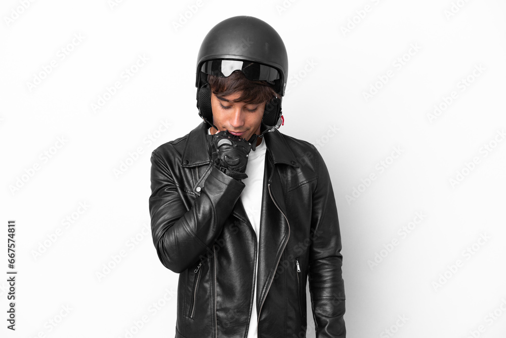 Young man with a motorcycle helmet isolated on white background having doubts Young man with a motorcycle helmet isolated on white background having doubts