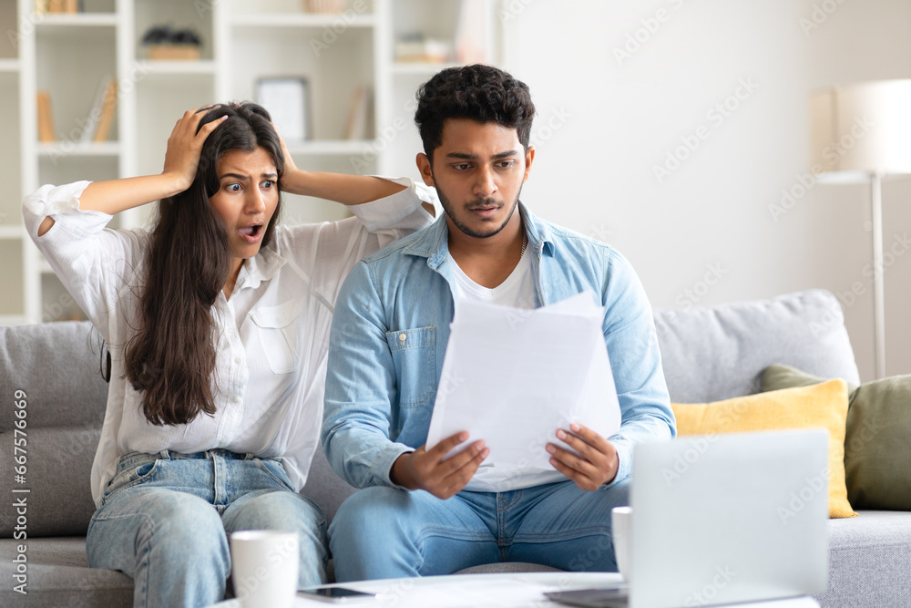 Young Indian couple reacts to shocking document at home Young Indian couple reacts to shocking document at home