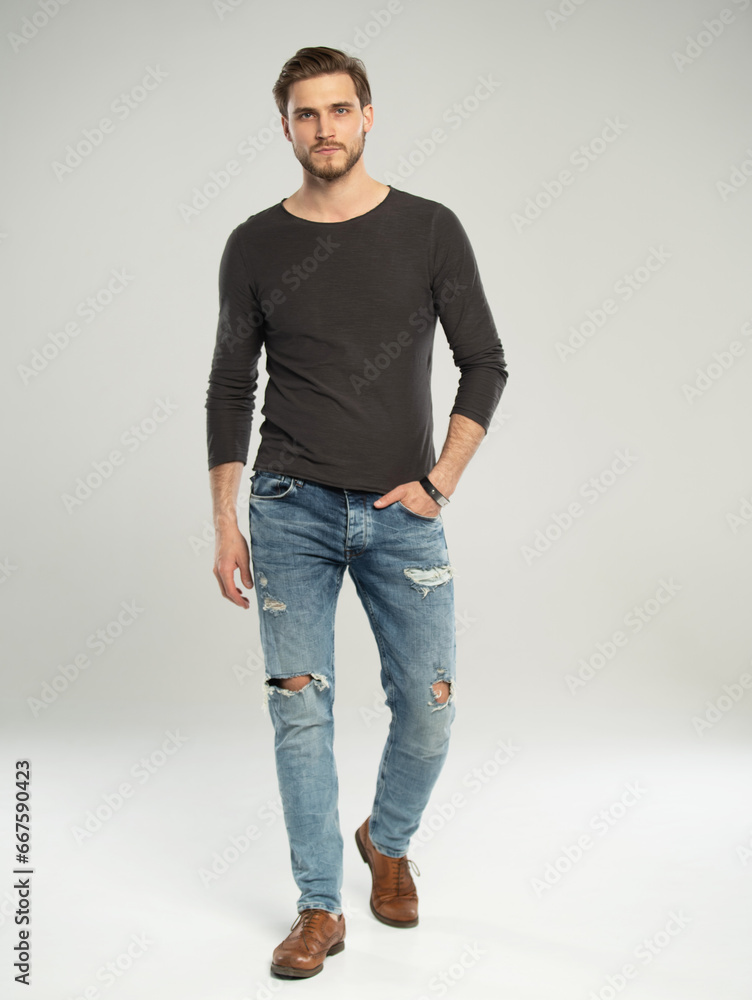 Full length portrait of happy handsome young man isolated on white background. Full length portrait of happy handsome young man isolated on white background.