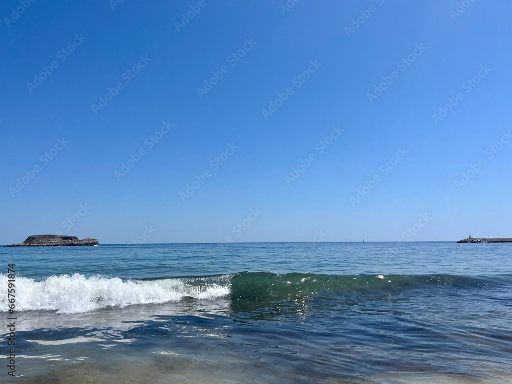 Blue sea horizon, waves seascape, blue clear sky, sandy coast