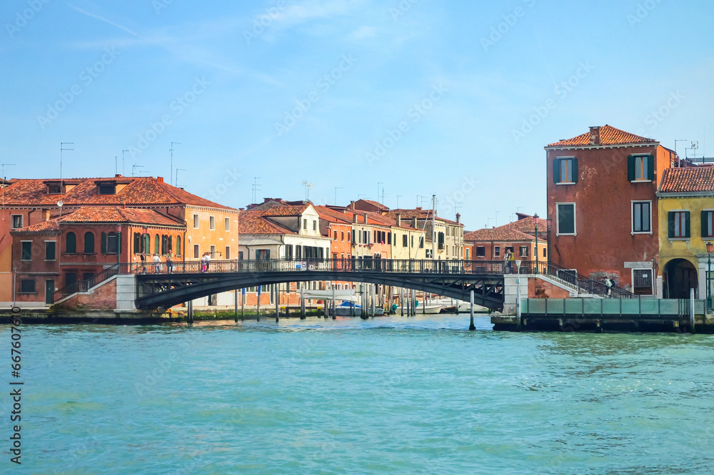 View from the window of the catamaran on the Venetian lagoon and the architecture of Venice, Italy.