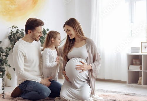 Portrait of a family with a young pregnant woman photo