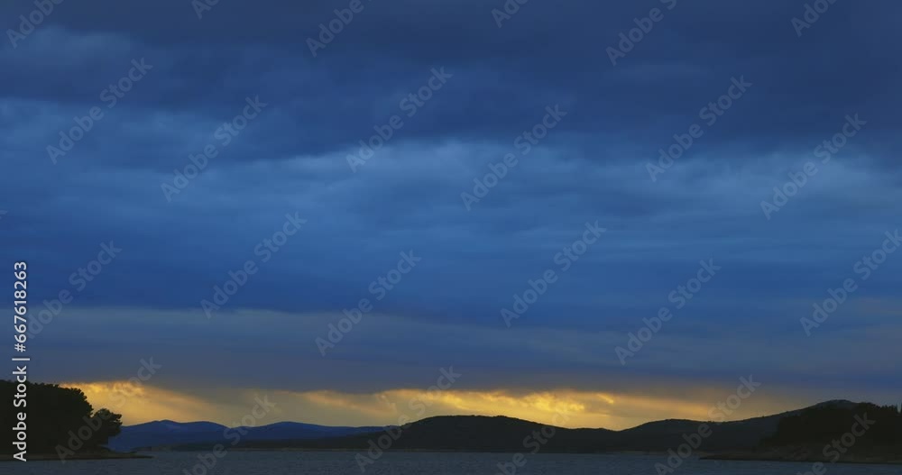 Heavy clouds and strong wind with waves in the evening on the Adriatic coast in Istra during sunset, Croatia Heavy clouds and strong wind with waves in the evening on the Adriatic coast in Istra during sunset, Croatia