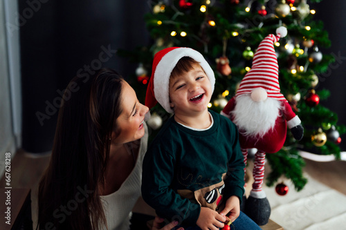 Mother with her son celebrating christmas at home
