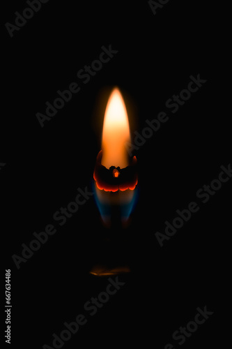 Candle flame in a ring on a black background