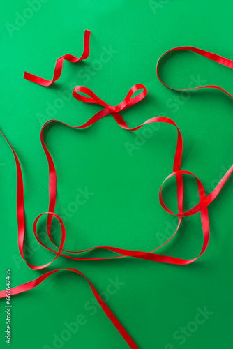 Christmas theme red ribbon green border background.