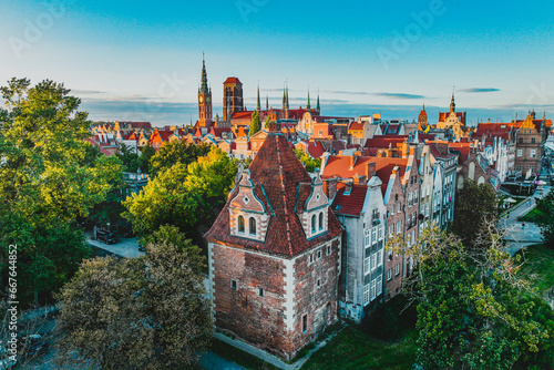 A magical image of Gdańsk at sunset. Urban landscape. Beautiful Main Town with old tenement houses. photo
