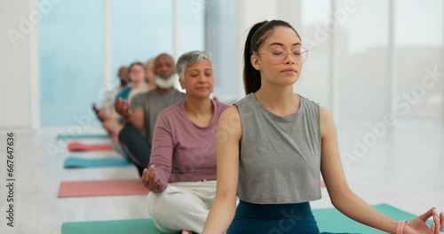 Woman, coach and zen meditation in yoga class for spiritual wellness, awareness or stress relief. Calm female person or yogi with group in mediating for healthy mind, body and health in fitness photo