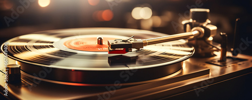 A modern turntable playing a vinyl album photo