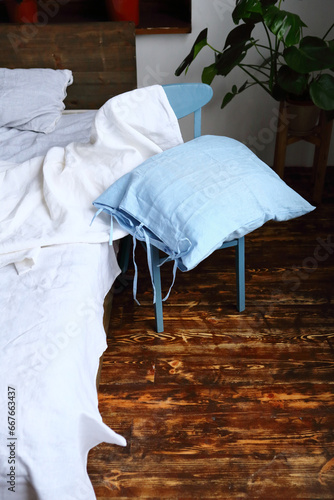 Blue linen pillow in bedroom bedclothes
