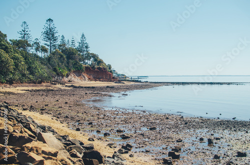 Rocky beach in Brisbane at midday photo