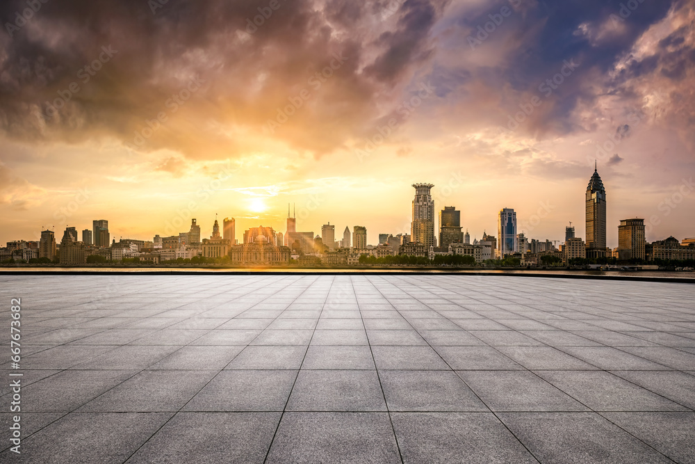 Brick floor and city buildings skyline in Shanghai at sunset