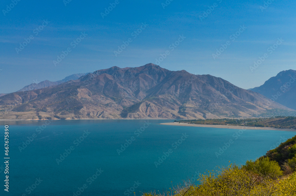 Charvak Reservoir and Chatkal mountains in autumn scenic view (Hojikent, Tashkent region, Uzbekistan) Charvak Reservoir and Chatkal mountains in autumn scenic view (Hojikent, Tashkent region, Uzbekistan)