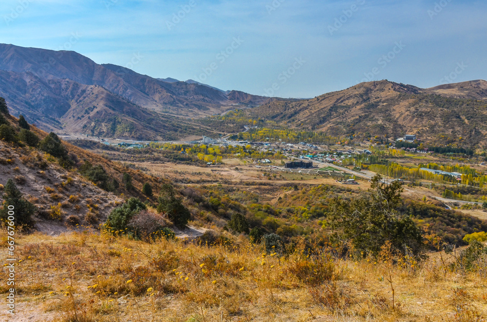 Chimgan village scenic view from Sandy Pass trail in Chatkal mountains (Bostanliq district, Tashkent region, Uzbekistan)