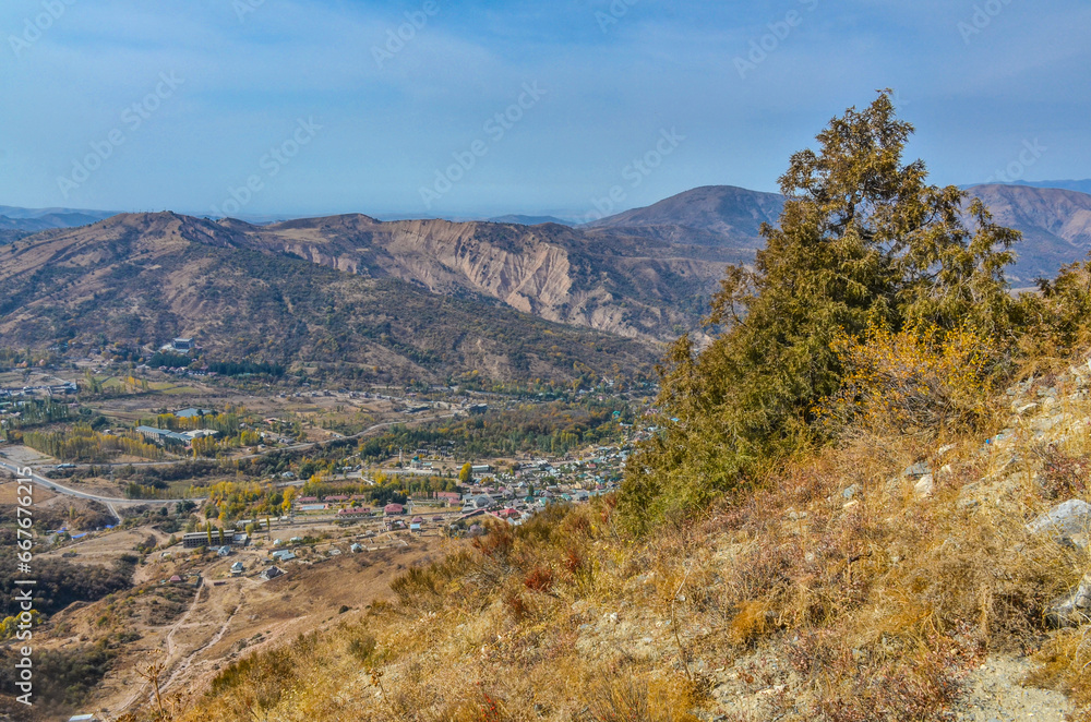 Chimgan village scenic view from Sandy Pass trail in Chatkal mountains (Bostanliq district, Tashkent region, Uzbekistan)