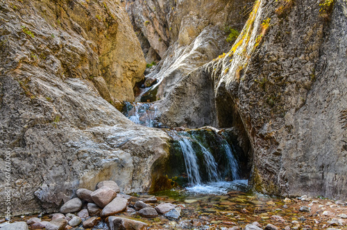 rapids and waterfalls on Gulkamsay creek in Chimgan mountains (Bostanliq district, Tashkent region, Uzbekistan) photo