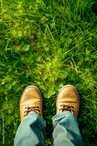 Child feet on the grass. Generative AI,