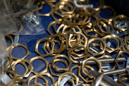 Brass thin nuts for securing cabinet locks.