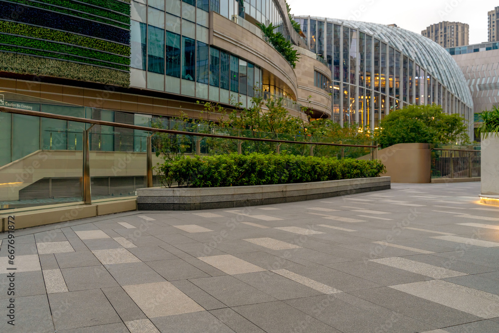 empty concrete floor in front of modern buildings in the downtown street. empty concrete floor in front of modern buildings in the downtown street.