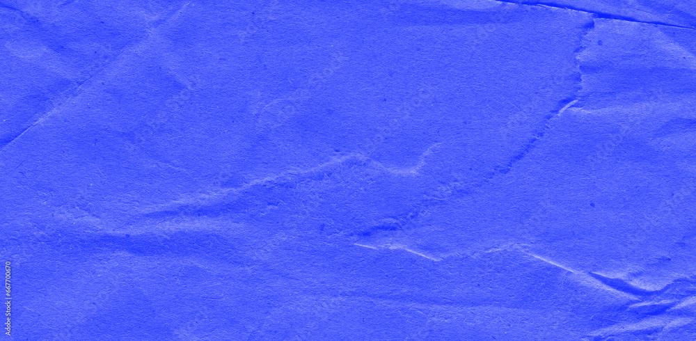 Obraz premium Recycled crumpled blue paper texture background. Royalty high-quality free stock photo image of Wrinkled and creased abstract backdrop, wallpaper with copy space, top view