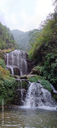 Panoramic landscape view of beautiful scenic Chunnu Summer Falls, a famous tourist place located at Rock Garden of Darjeeling, West Bengal, India