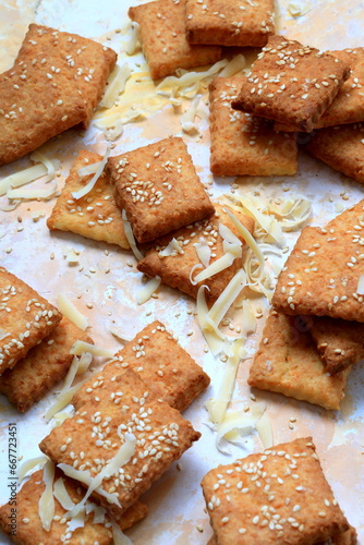 Homemade cheese cookies with sesame on a plate photo