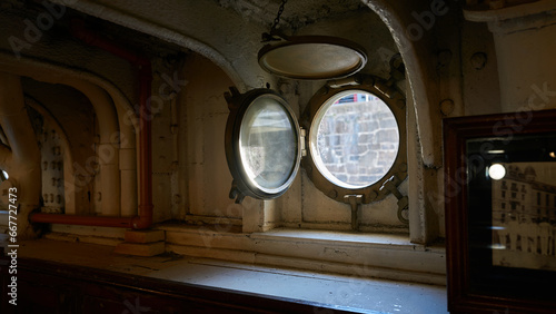 Interior of a ship with a porthole.