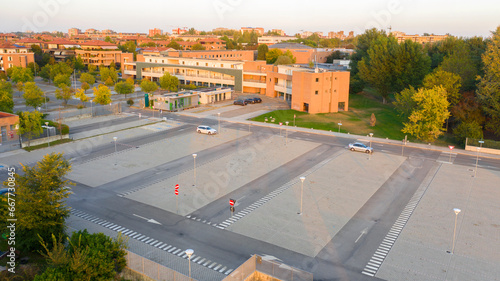 Aerial view of a parking lot at sunset.