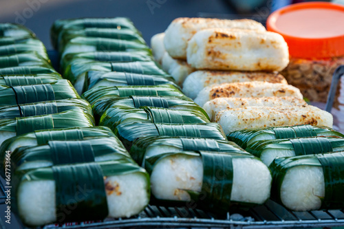 Vietnamese food sticky rice wrapped by green leaf from Vietnam local street market.