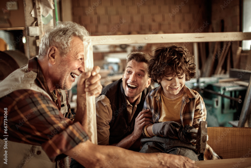 Three Generations of Carpenters : Grandfather, Father, and Son working in the Workshop Three Generations of Carpenters : Grandfather, Father, and Son working in the Workshop