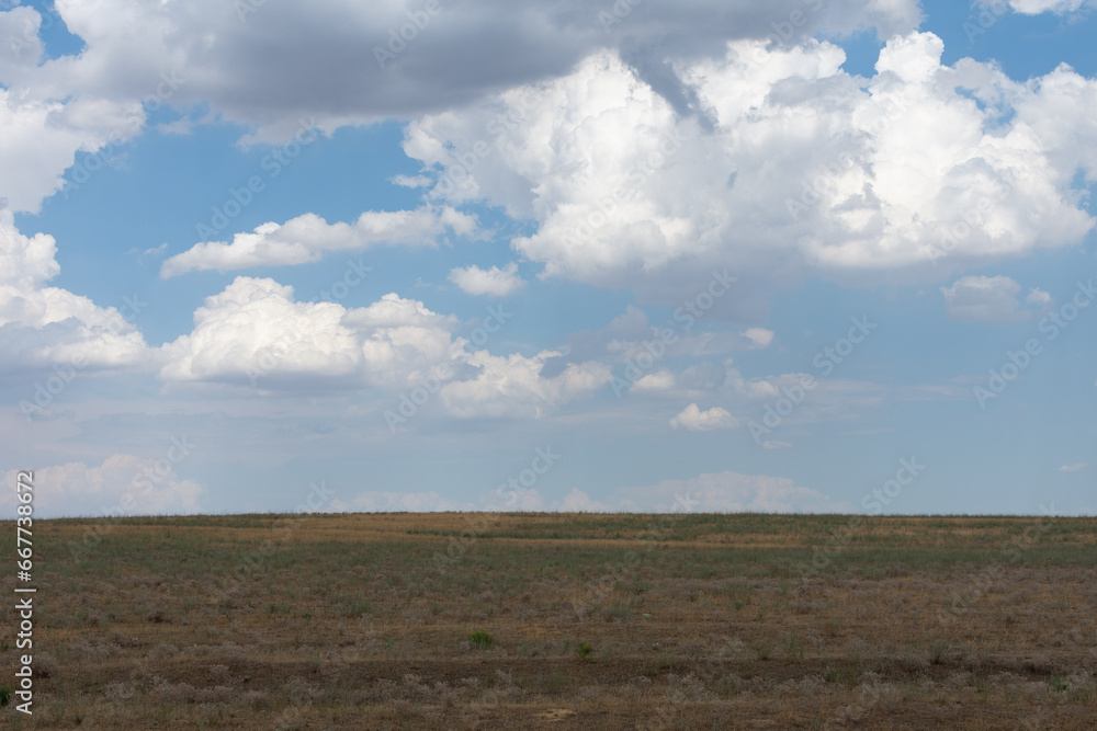 clouds in the sky and steppe, horizon.