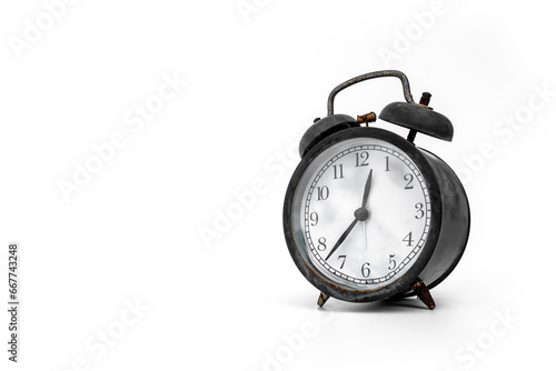Black alarm clock analog classic vintage style old and rusty isolated on white background.