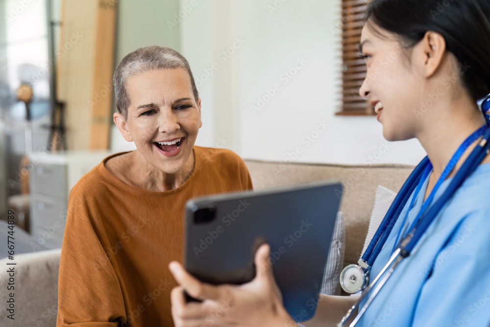 Asian nurse showing health checkup report to older and giving advice. Home nursing and healthcare caregiver concept Asian nurse showing health checkup report to older and giving advice. Home nursing and healthcare caregiver concept