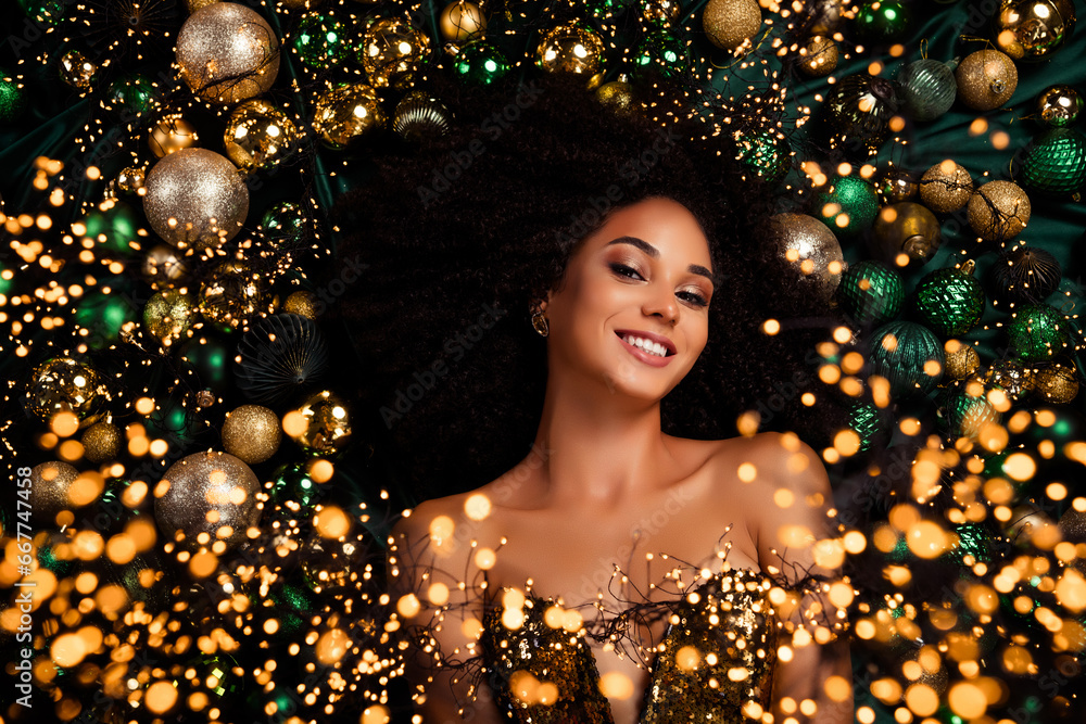 Flatlay top view photo of positive charming lady enjoy traditional christmas celebration decor with garlands tinsels Flatlay top view photo of positive charming lady enjoy traditional christmas celebration decor with garlands tinsels