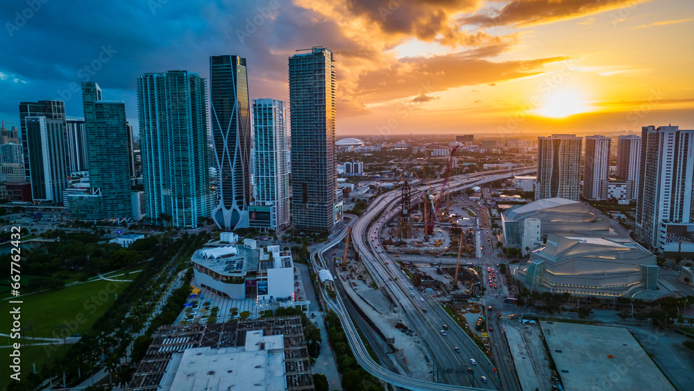 Naklejka premium aerial sunset of Miami Downtown Skyscrapers and Highway Traffic, USA