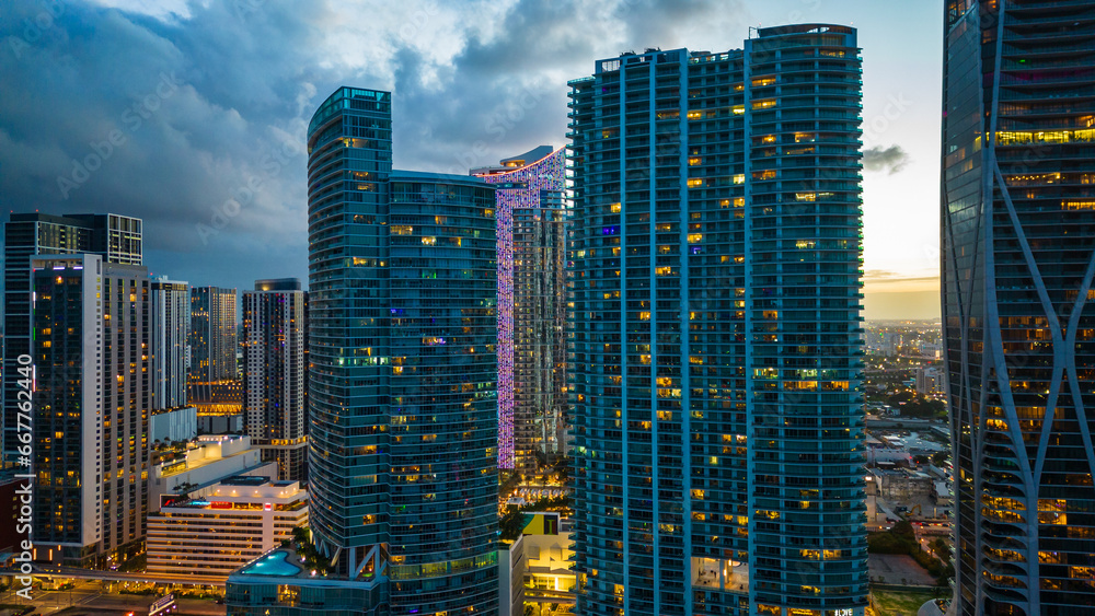 Obraz premium modern skyline smart city cityscape of Miami Usa Florida downtown skyscraper illuminated at night sunset 