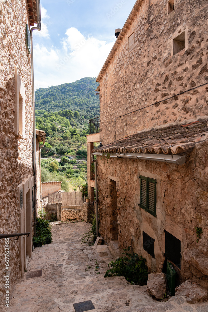View of a medieval street of the picturesque Spanish-style village Valdemossa in Majorca island, Spain.