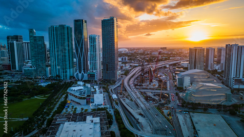 aerial sunset of Miami Downtown Skyscrapers and Highway Traffic, USA
