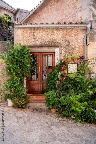 View of a medieval street of the picturesque Spanish-style village Valdemossa in Majorca island, Spain.