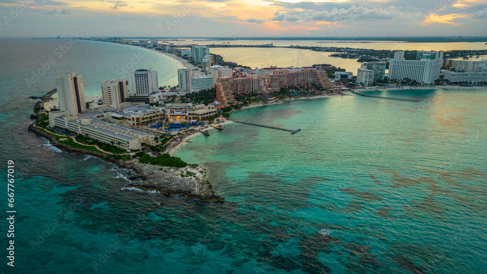 Cancun Mexico Aerial of Hotel zone tourist beach resort travel holiday destination at sunset 