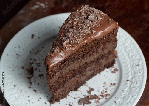 Chocolate cake or brigadeiro cake whole or slice in a white plate