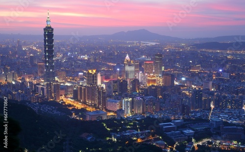 Panoramic aerial view of Downtown Taipei City at dusk, with Taipei 101 Tower in Xinyi Commercial District ~A romantic evening in Taipei, capital city of Taiwan, with dramatic rosy afterglow in the sky